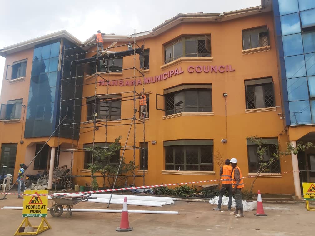 Municipal building works with scaffold and crew